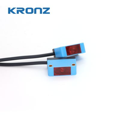 Prezzo buono Sensore fotoelettrico quadrato PNP BQ26-T15P Distanza di rilevamento attraverso il raggio 50 mm-15 m in linea